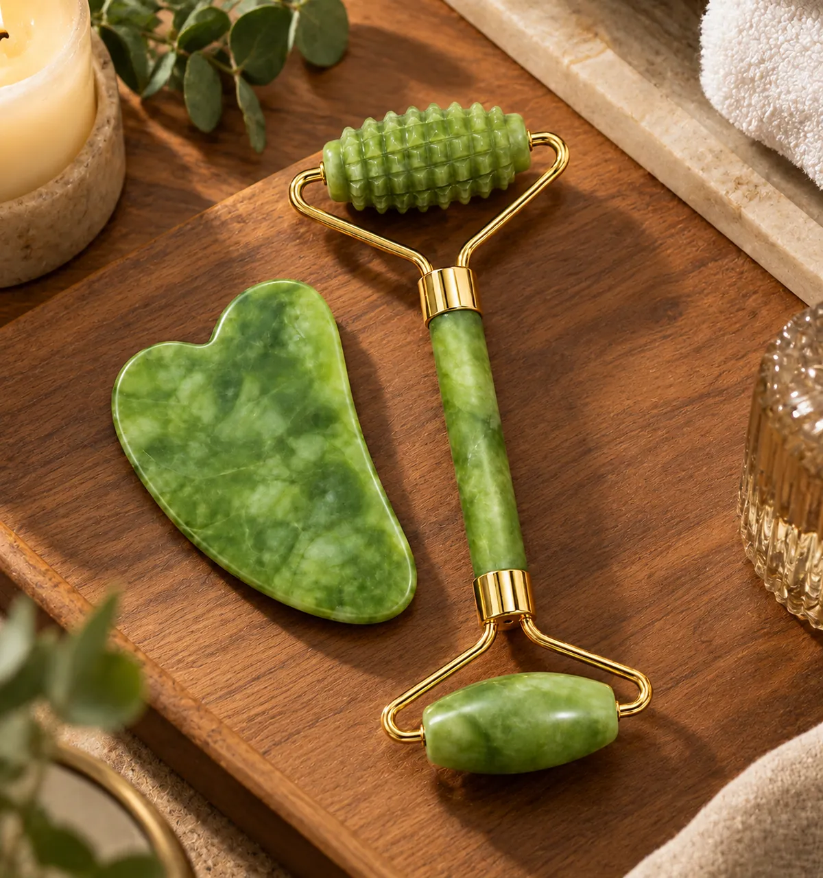 The complete ORVALE CO. ritual set: jade roller and heart-shaped gua sha on a light studio background